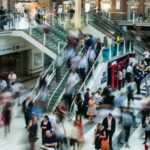 people standing and walking on stairs in mall